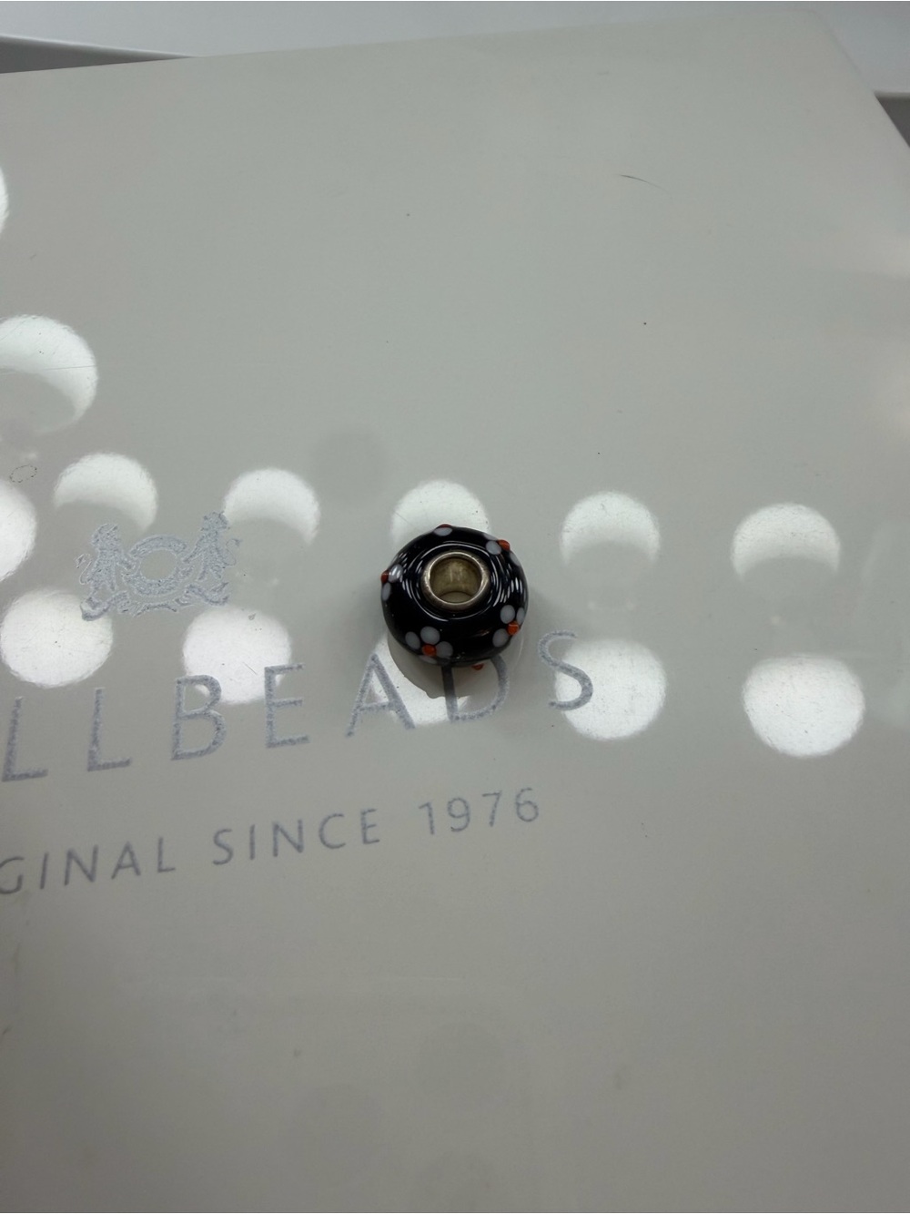 Trollbeads Black Glass Bead with White and Orange Dots
